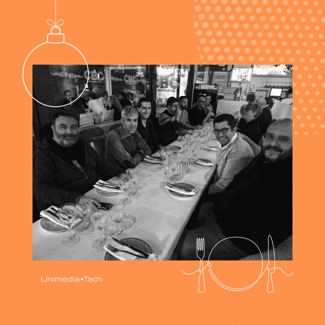 Unimedia team members seated together at the 2023 Christmas dinner