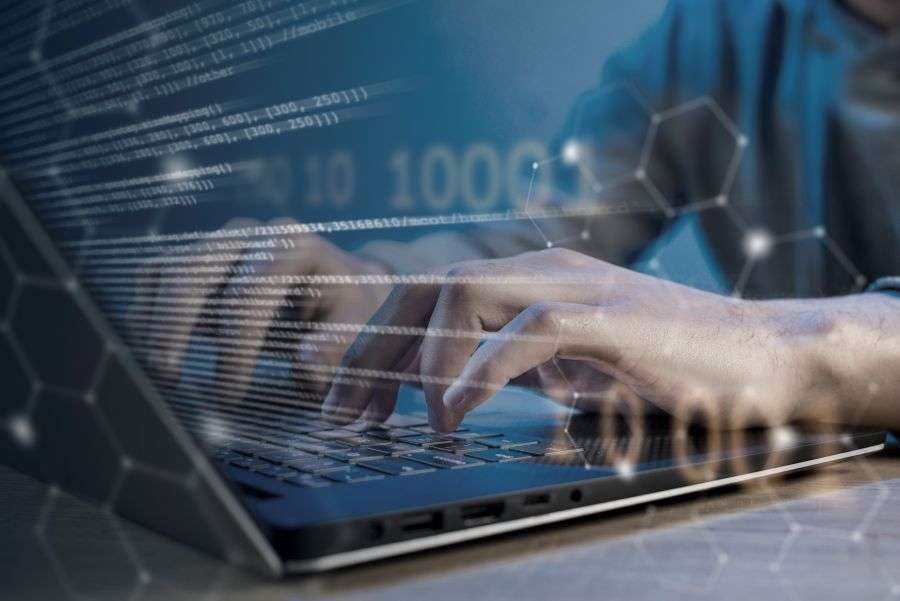 software development in Spain represented by developer coding on laptop in a modern tech environment